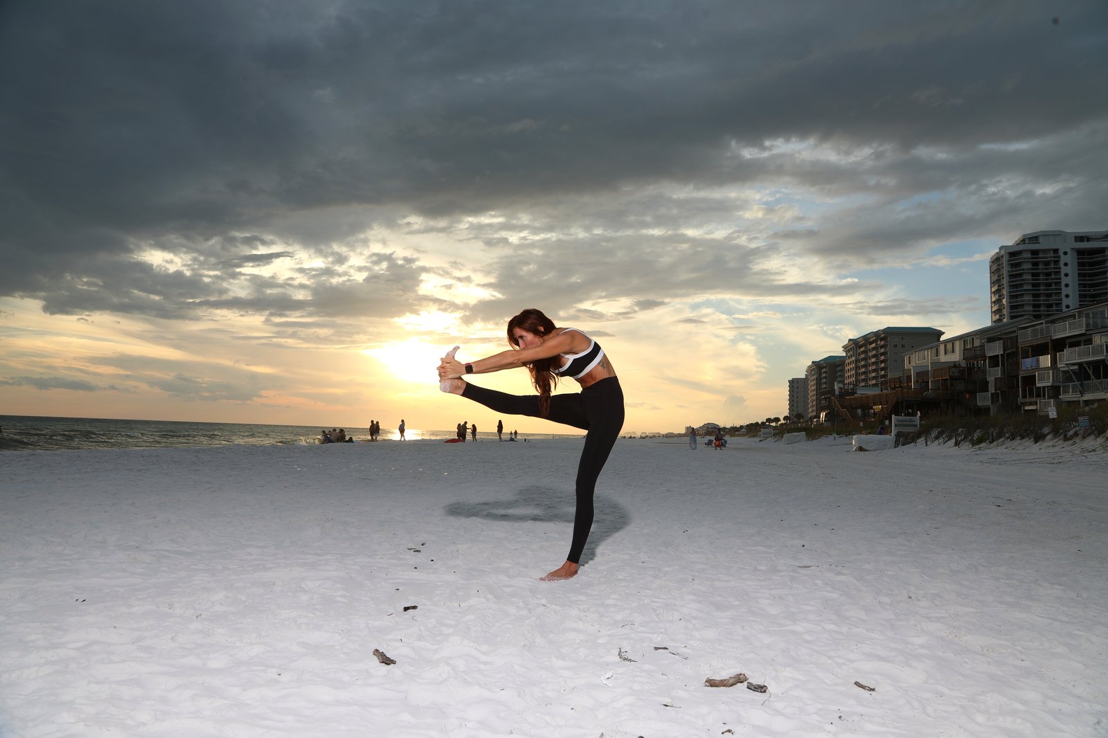Megan Baye practicing beach yoga on the Emerald Coast in Destin & Miramar Beach, FL